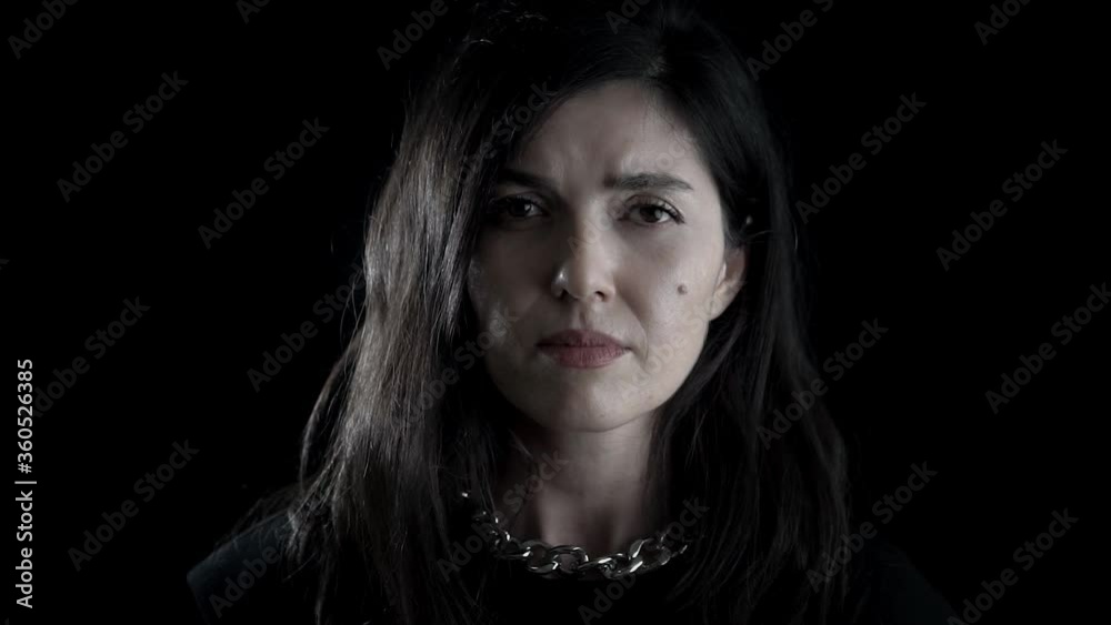 Sad, unhappy girl face portrait on black background. Studio shot of close up face, gesturing woman in depression. Sad, unhappy girl face portrait on black background. Studio shot of close up face, gesturing woman in depression.