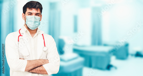 Doctor wear face mask in hospital protect from coronavirus disease or COVID-19. Medical staff are high risk people to receive infection from coronavirus disease or COVID-19. photo