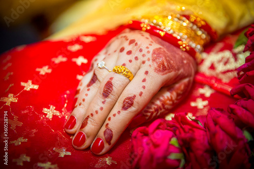A bride's hand full of gold ornaments. Indian Wedding.