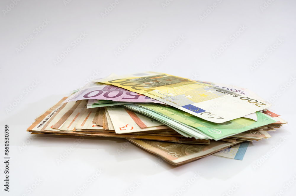 stack with euro banknotes on a white background. A bunch of different euro money. Financial concept. stack with euro banknotes on a white background. A bunch of different euro money. Financial concept.