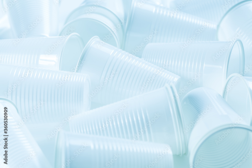 Disposable plastic cups as background. Environmental concept. Non-compostable waste Disposable plastic cups as background. Environmental concept. Non-compostable waste