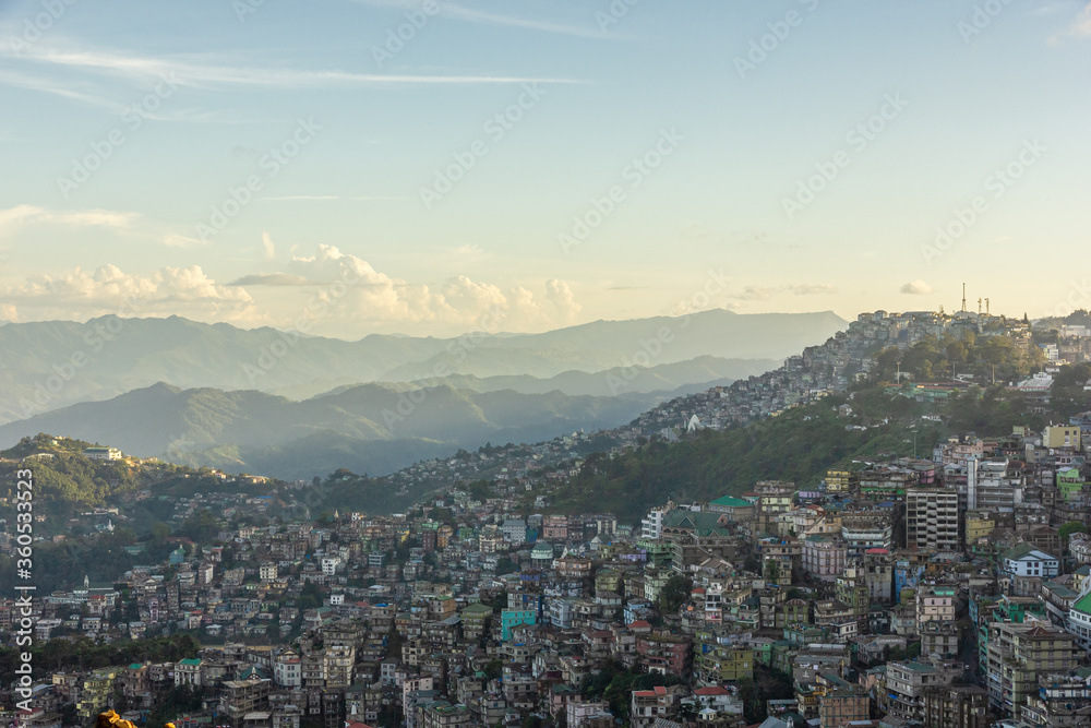 Landscape of buildings clustered on the hills of the city of Aizawl in Mizoram in Northeast India.