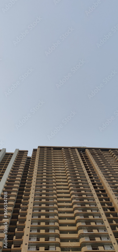 A high rise apartment building reaching for the sky A high rise apartment building reaching for the sky