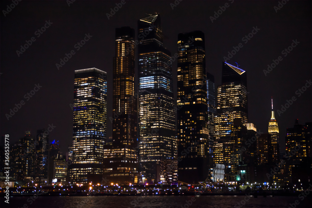 Winter cruise . New York City skyline by night. View from Hudson river, New York, USA, America. 