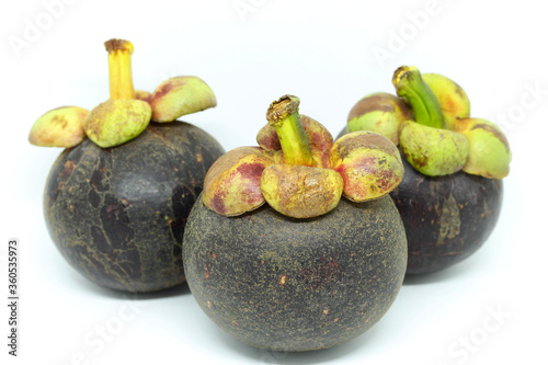 Tropical mangosteen on white background.