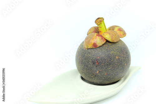 Tropical mangosteen on white background.