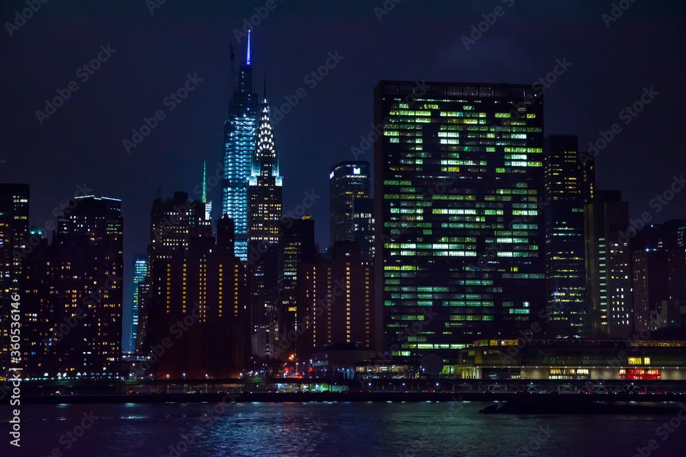 Fototapeta premium Winter cruise . New York City skyline by night. View from Hudson river, New York, USA, America. 