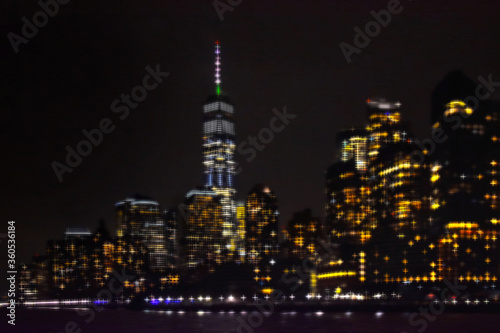 New York City skyline by night. View from Hudson river.  Motion blur creative image.