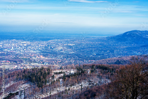 Panoramic view of Bielsko Biala city from the slopes of Szyndzielnia in Beskid Slaski, Poland. Bielsko is a city located at the foot of the mountains with good tourist infrastructure. photo