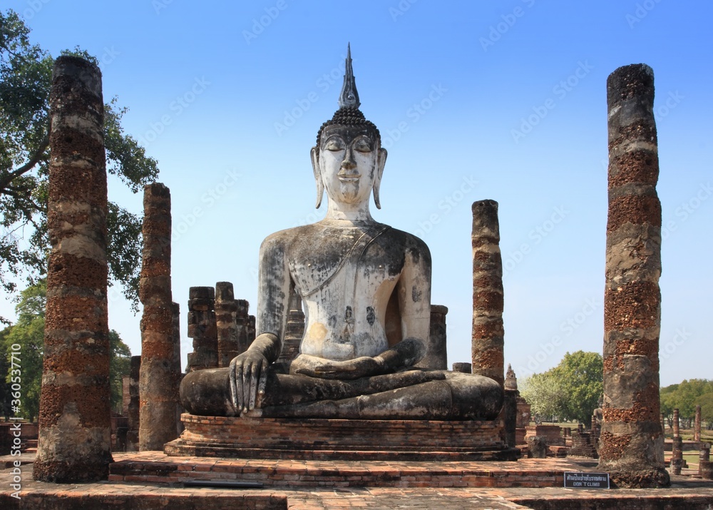 Statue of Buddha in Sukothai Historical Park. Ancient city Sukothai is now famous tourist destination in Thailand.