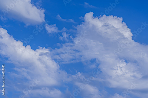 Blue sky with clouds. Natural fresh background. High quality photo