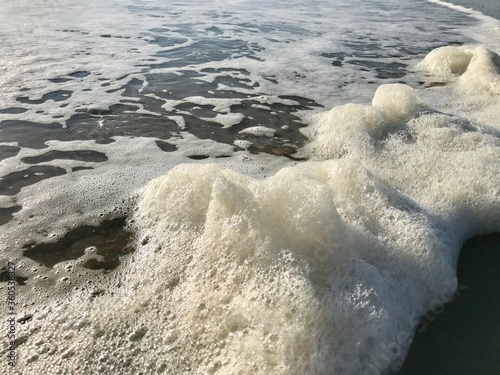 wave and foam on the beach