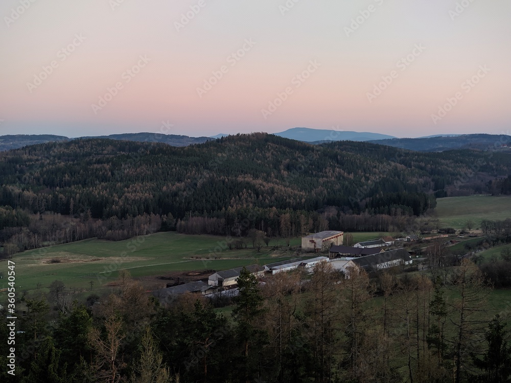 evening sunset over the south bohemian mountains and woods viewed from the lookout tower