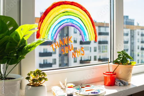Rainbow on window during quarantine at home. photo