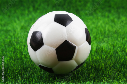 Traditional soccer ball on soccer field. Football ball on green grass stadium football field, game, sport. Background for design. © detry26