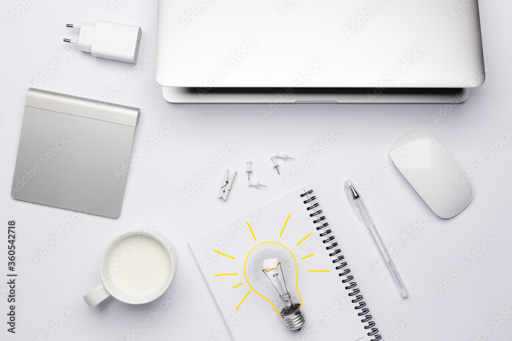 Top view on working place with yellow lamp as a symbol of idea coming, creativity. Top view on working place with yellow lamp as a symbol of idea coming, creativity.