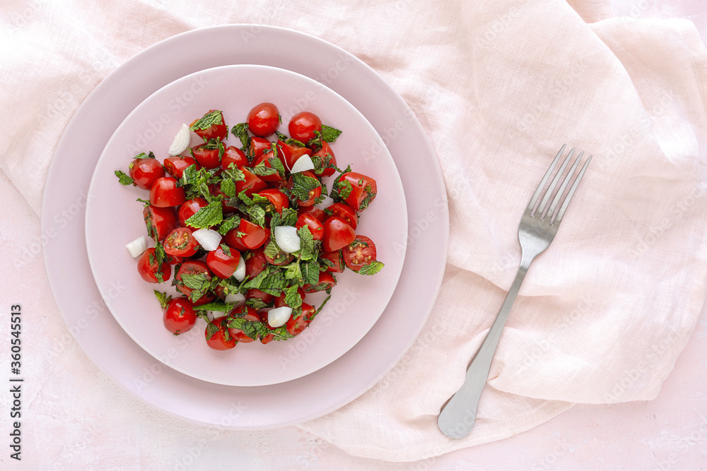Homemade cherry tomato salad with fresh onions, mint, olive oil and salt