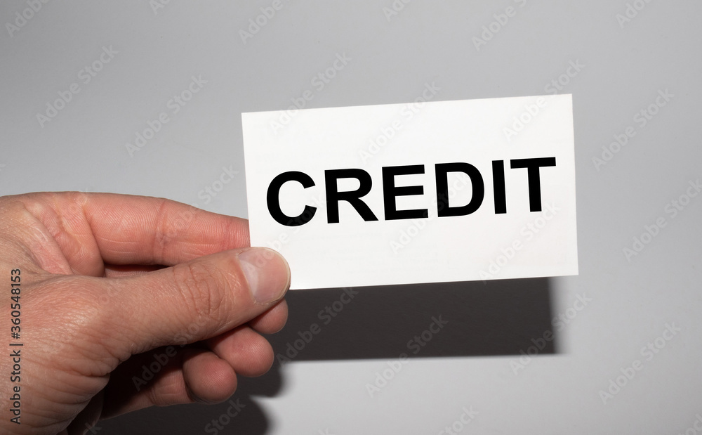 Message on the card CREDIT, in hands of businessman. Message on the card CREDIT, in hands of businessman.
