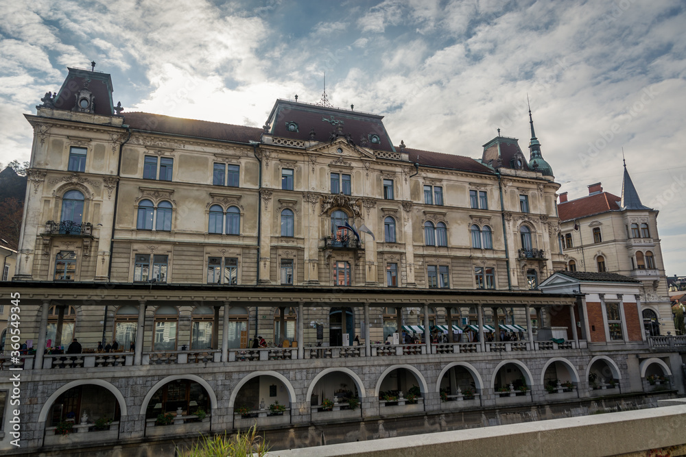 Fototapeta premium Local government office building in Ljubljana city, Slovenia. View from other side of Ljubljanica river. Beautiful sunny day