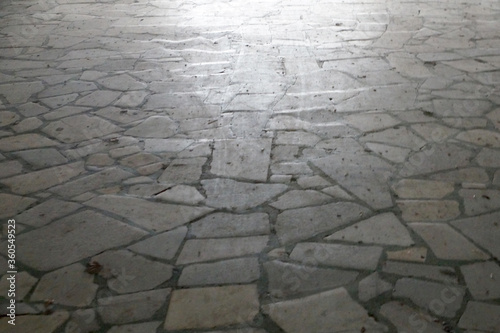 natural stone pavement reflecting daylight close up