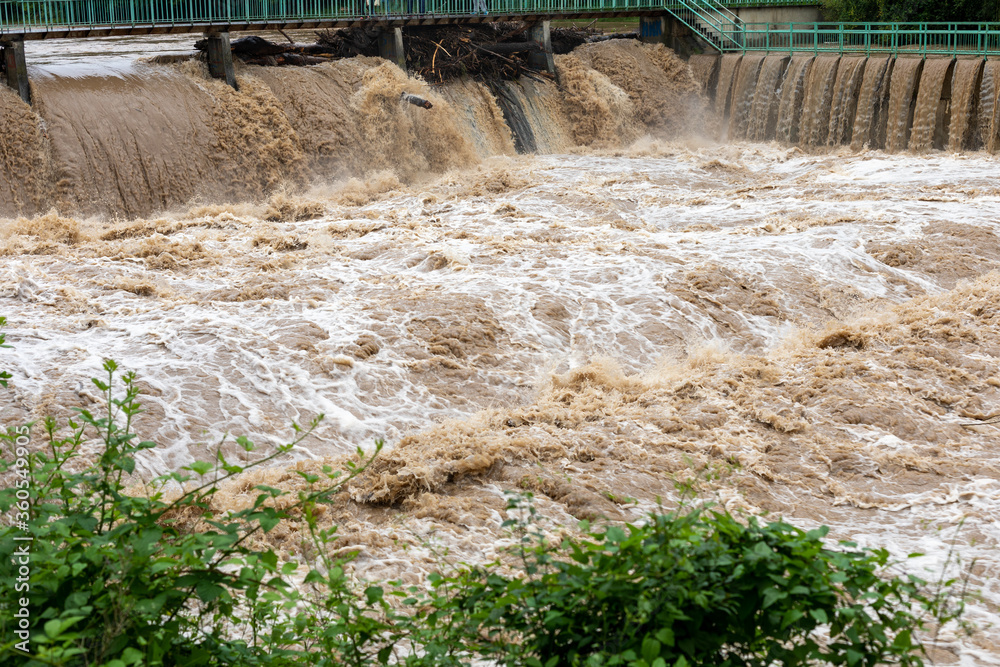 Obraz premium Flooding after storm - unglean water with soil comming