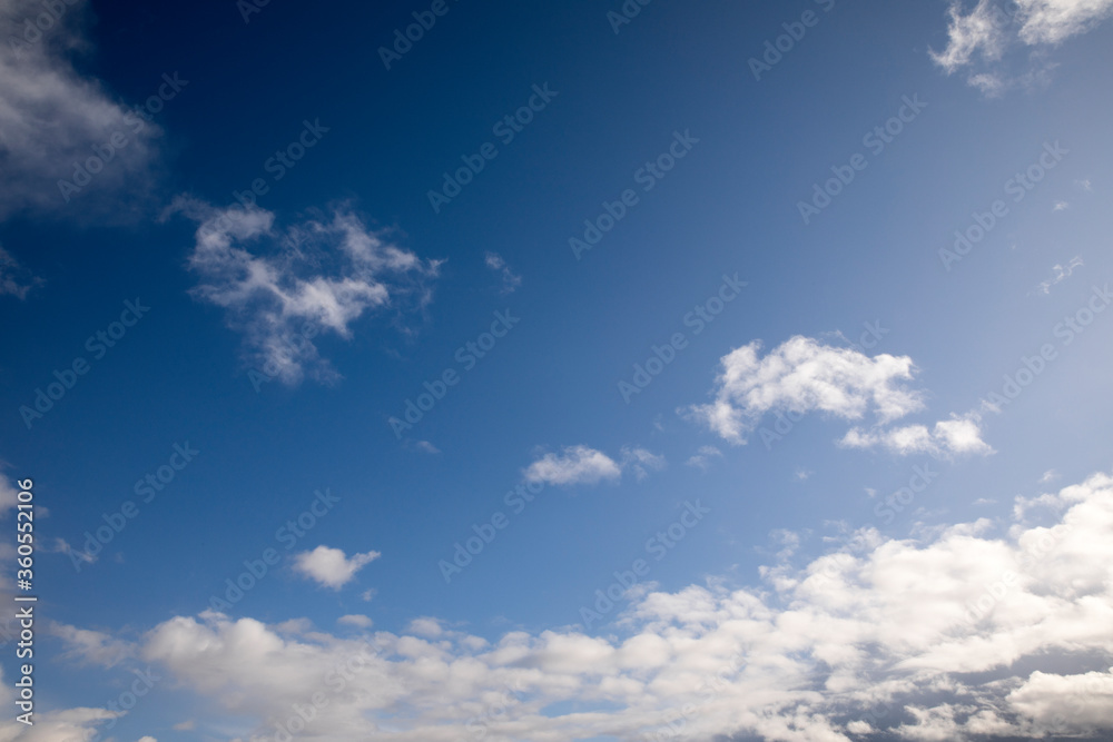 Blue sky with little white clouds around Blue sky with little white clouds around