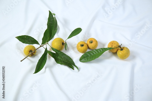 Wallpaper Mural Fresh ripe tasty eggfruits with leaves isolated on white background Torontodigital.ca