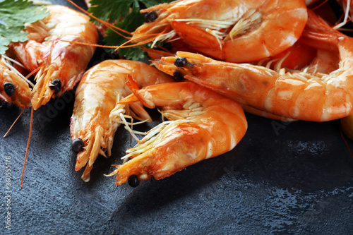 Raw fresh Prawns Langostino Austral. shrimp seafood with fresh lemon and spices.