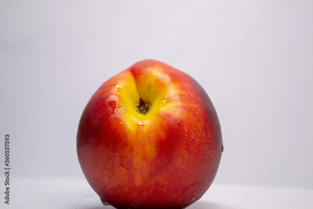 red-yellow nectarine on a white background red-yellow nectarine on a white background