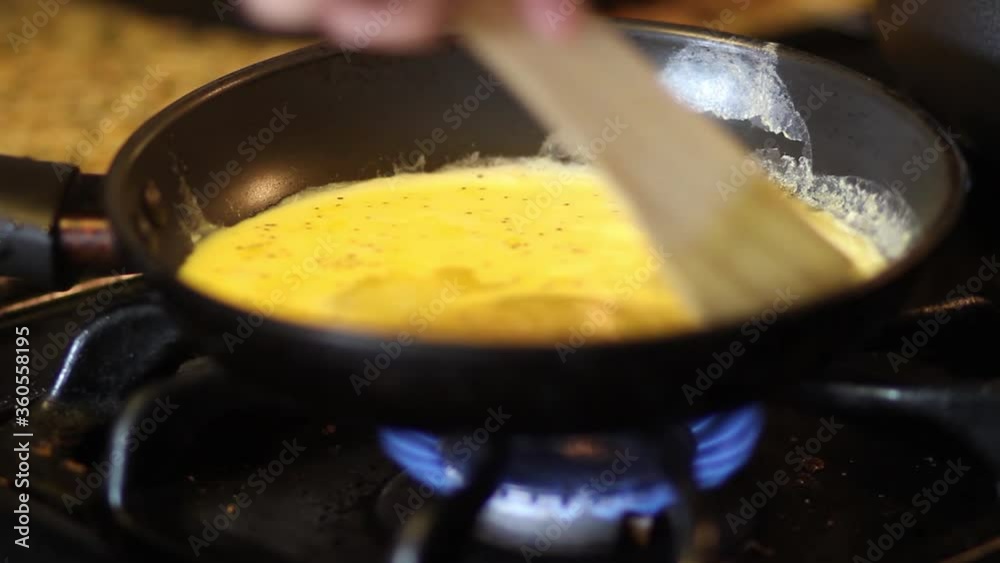 Mixing eggs in a pan Mixing eggs in a pan