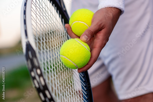 Close up of tennis racket and balls. © ivanko80