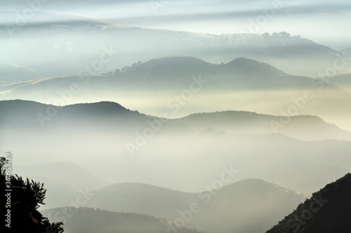 Misty mountain ridges above...
