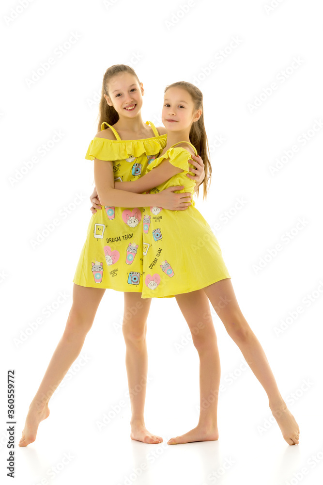 Beautiful Barefoot Teen Girls Standing Together and Hugging Beautiful Barefoot Teen Girls Standing Together and Hugging