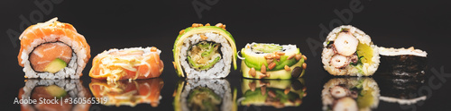 Sushi roll set on black glass background