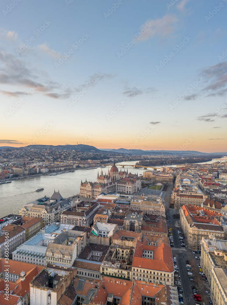 Aerial drone shot of Hungarian Parliament Kossuth Square by Danube river in Budapest sunset