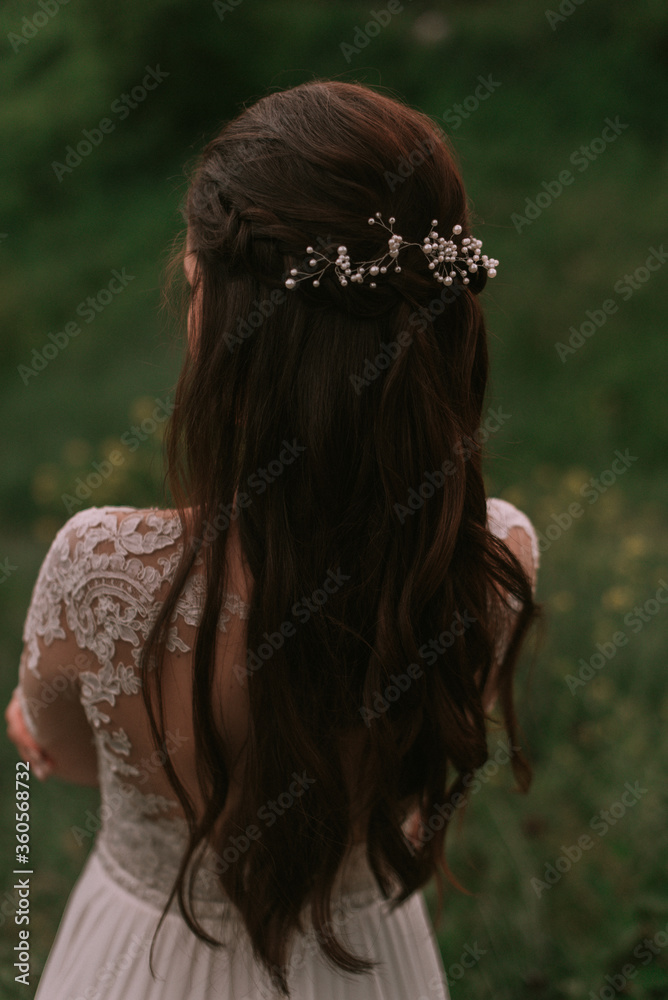 Bride walking through the park Bride walking through the park