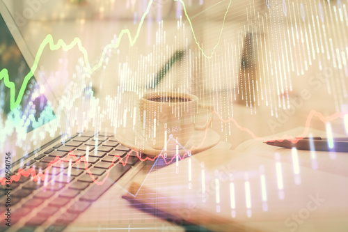 Wallpaper Mural Double exposure of financial chart drawing and desktop with coffee and items on table background. Concept of forex market trading Torontodigital.ca