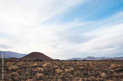 mountain landscape in the desert with blue sky and clouds