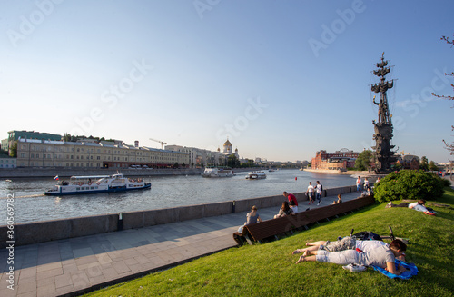 People on Crimean embanlment  - amazing park and nature - Moskva River and ships and giant Statue of Peter the great