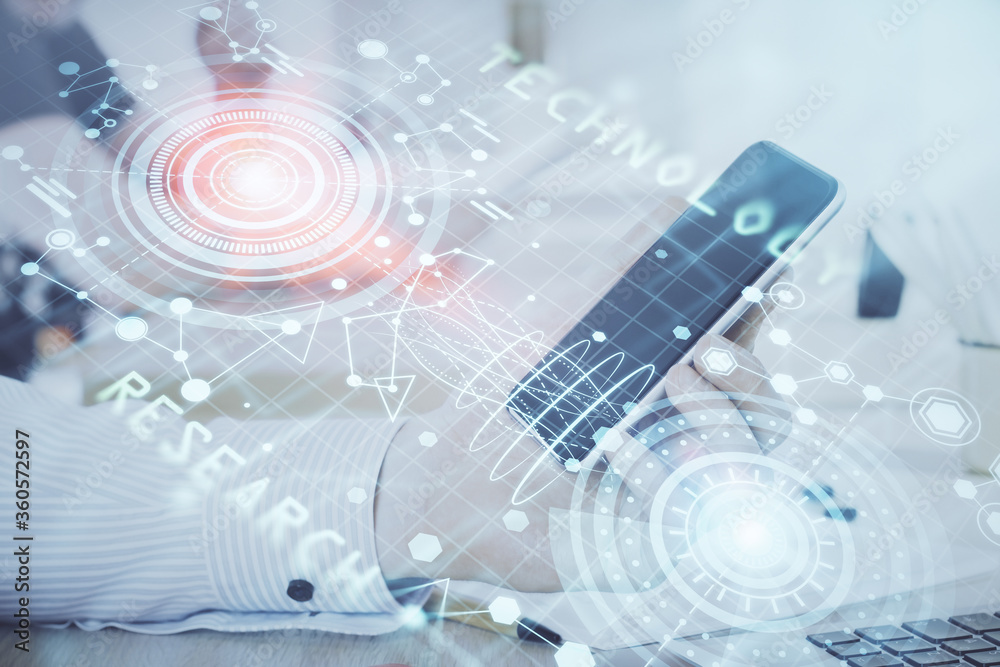 Double exposure of man's hand holding and using a digital device and data theme hologram drawing. Technology concept. Double exposure of man's hand holding and using a digital device and data theme hologram drawing. Technology concept.