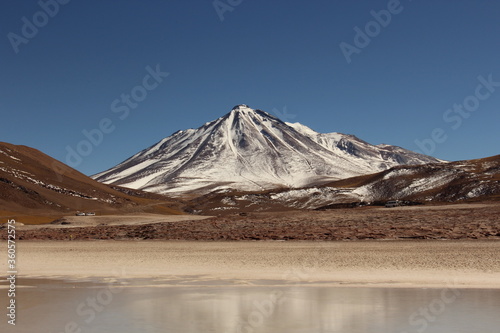 View of "Cainchique" Vulcan covered with snow from "Piedras Rojas" in Atacama Desert, Chile.