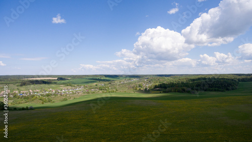 Photo from a drone. Agricultural fields. Aerial View of agricultural fields in countryside of Japan in sp. Crops, green.