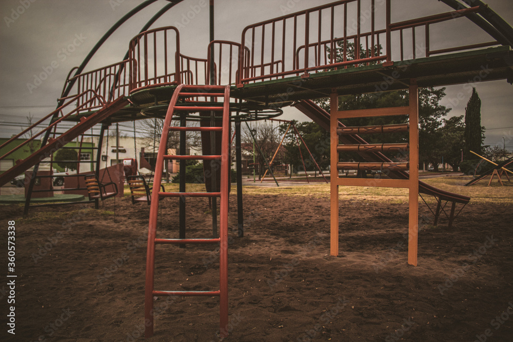 large metal and wood slide of various colors such as blue, red, orange and yellow
large metal and wood slide of various colors such as blue, red, orange and yellow