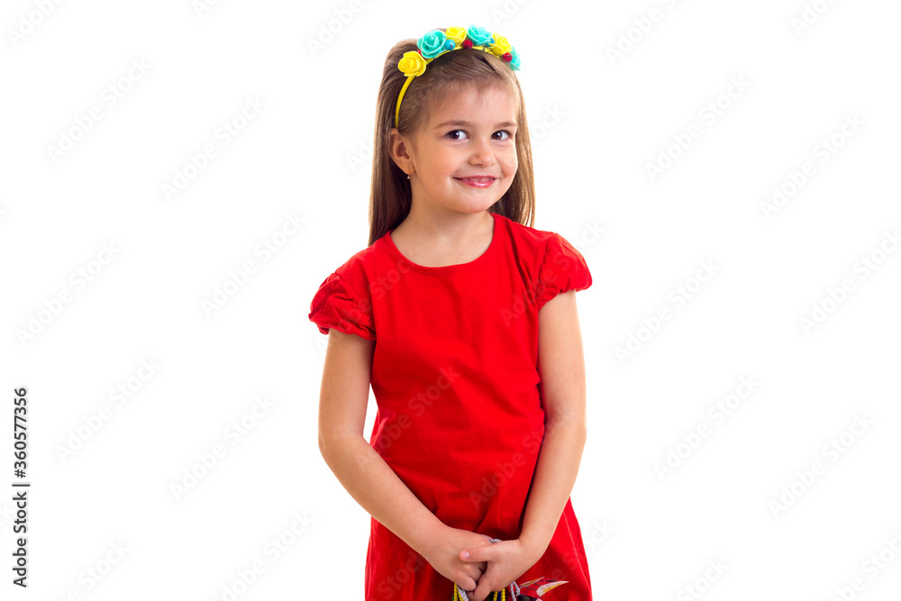 Little girl in red dress at white background. Little girl in red dress at white background.