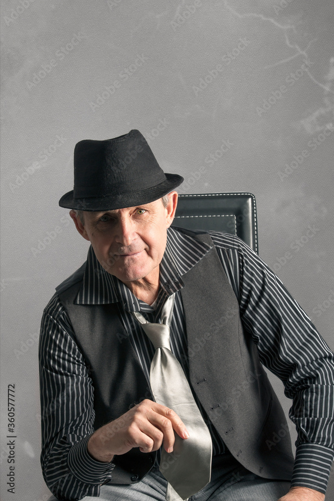elegant elderly man with clear eyes, sitting looking straight ahead elegant elderly man with clear eyes, sitting looking straight ahead