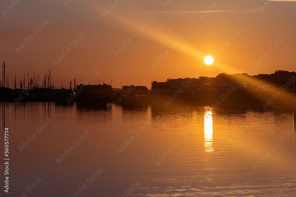 Sunrise over marina and RV site Sunrise over marina and RV site