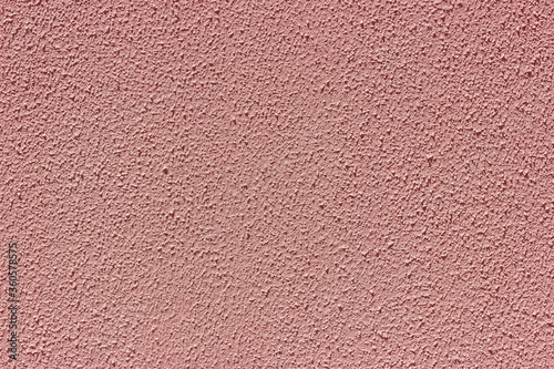 Pink embossed stucco on the wall.