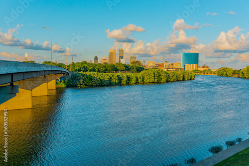 The White River and bridge lead to downtown Indianapolis in Indiana in the last light of the day.