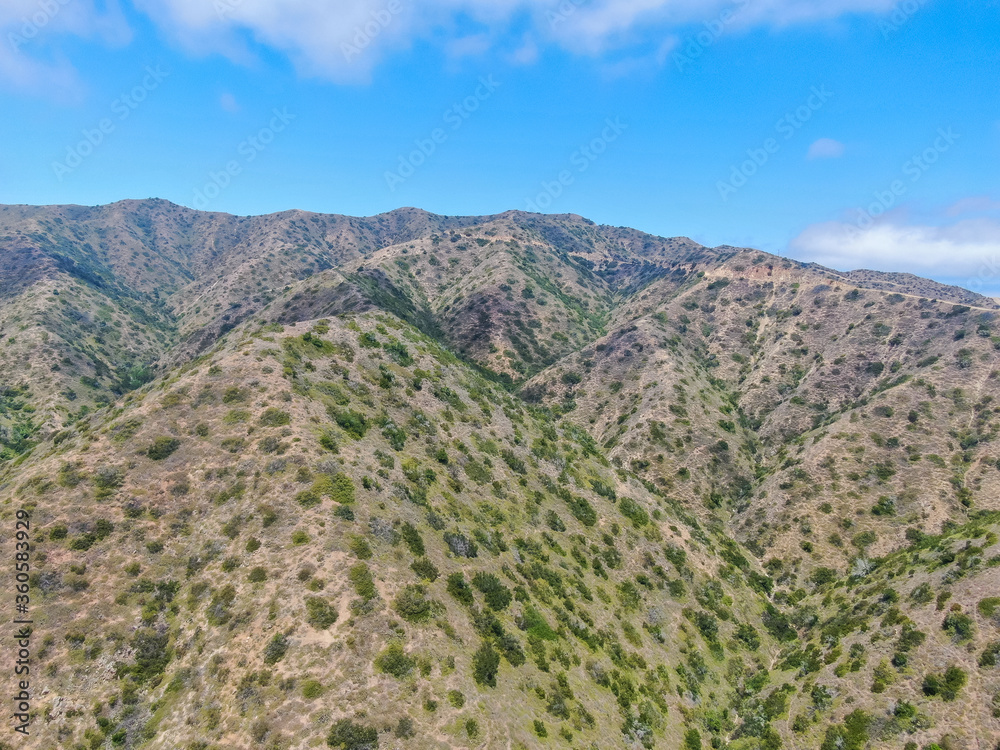 Aerial view Santa Catalina Island mountain peaks with blue sky. California, USA