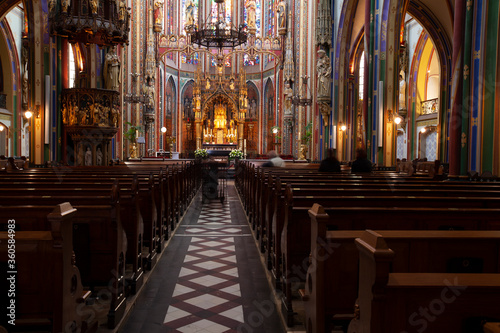 Scenic interior of the famous Catholic Church De Krijtberg Kerk. Long exposure shoot offers minute details of the vibrant decors  sanctuary  corridor and seats.